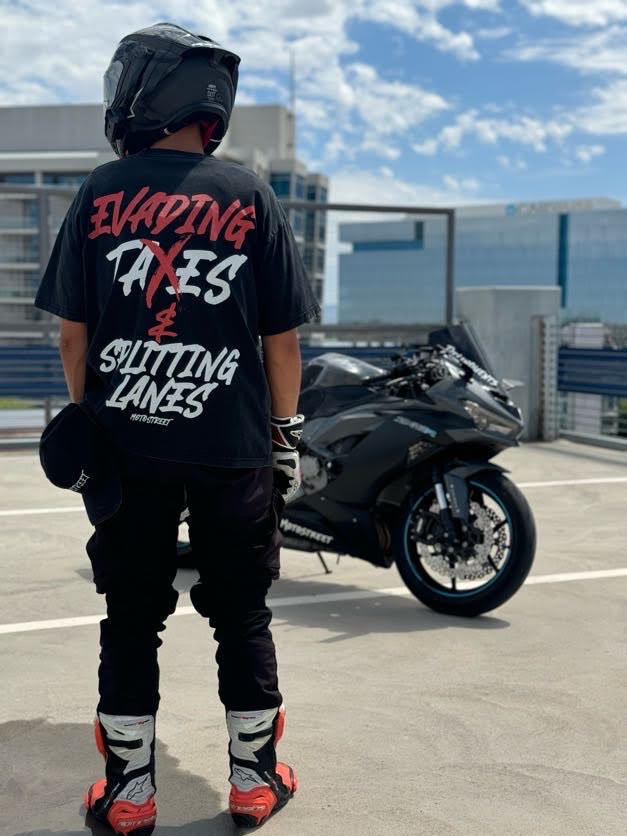 Oversized 'Evading Taxes & Splitting Lanes' Tee for Motorcycle & Streetwear Enthusiasts - Loose Fit with Wide Arm Holes, Drop Shoulder Design, Comfortable and Durable Biker T-Shirt Celebrating Riding Culture and motorcycle rider gift ideas.